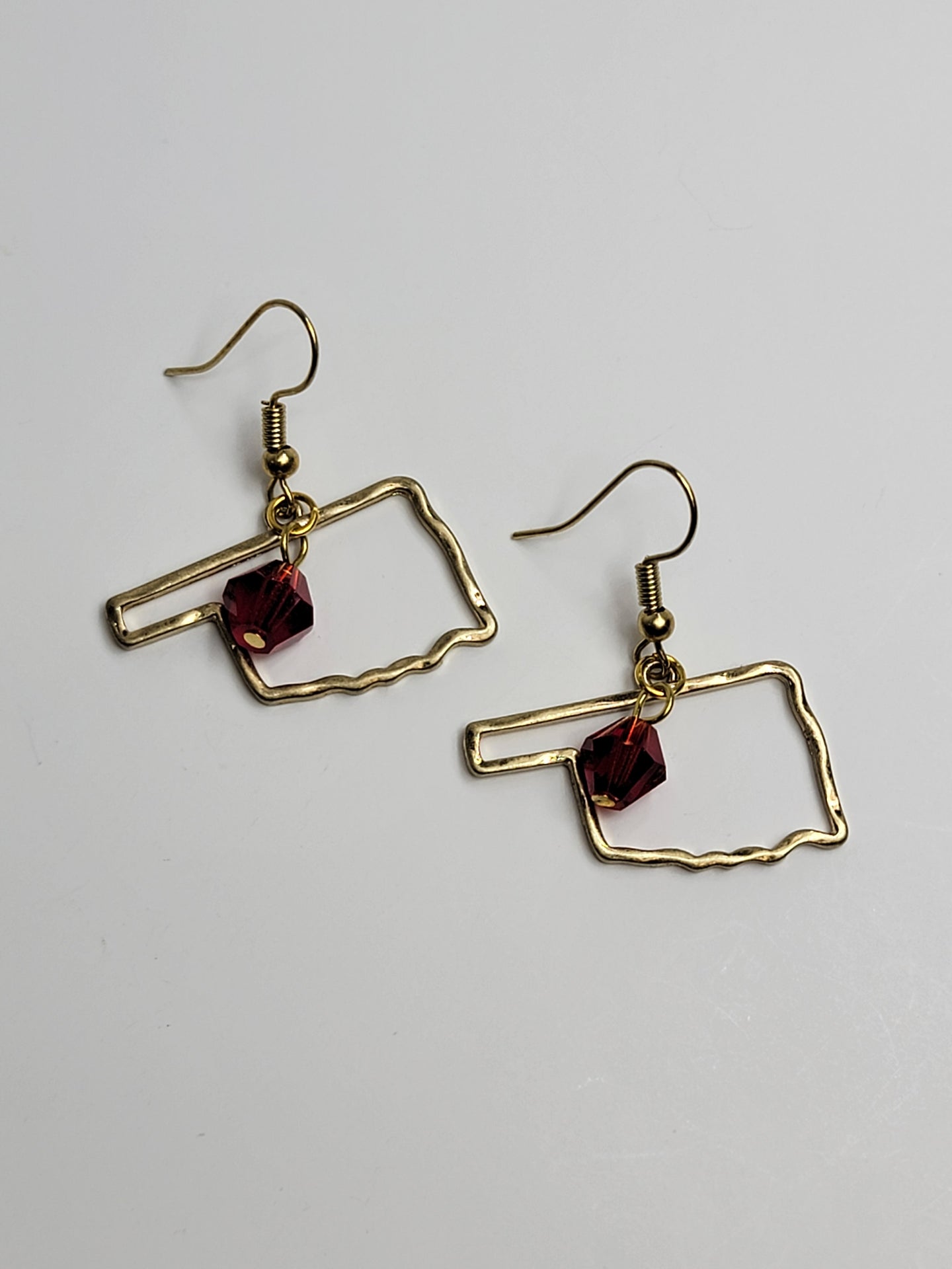 Gold Oklahoma Outline Earrings - Ruby Crystal